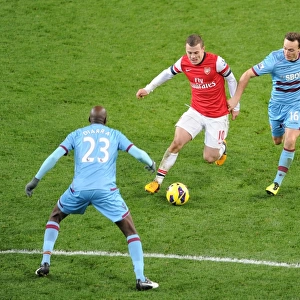 Arsenal's Jack Wilshere Faces Off Against Mark Noble and Alou Diarra of West Ham United