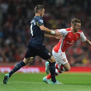 Arsenal's Jack Wilshere Faces Off Against Southampton's Morgan Schneiderlen in League Cup Clash