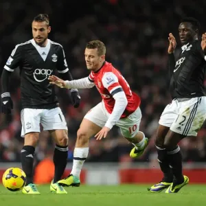 Arsenal's Jack Wilshere Faces Off Against Southampton's Victor Wanyama and Dani Osvaldo in Premier League Clash