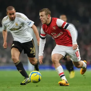 Arsenal's Jack Wilshere Faces Off Against Swansea's Ashley Richards in FA Cup Third Round Replay Arsenal's Jack Wilshere Faces Off Against Swansea's Ashley Richards in FA Cup Third Round Replay