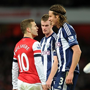 Arsenal's Jack Wilshere Faces Off Against West Brom's Jonas Olsson and Chris Brunt during the 2012-13 Premier League Match