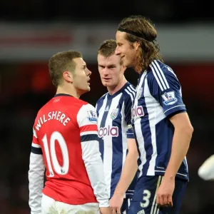 Arsenal's Jack Wilshere Faces Off Against West Brom's Jonas Olsson and Chris Brunt during the 2012-13 Premier League Match