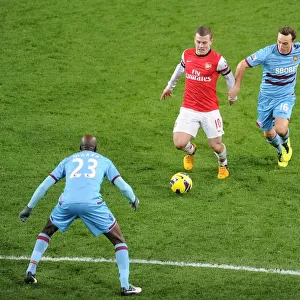 Arsenal's Jack Wilshere Faces Off Against West Ham's Mark Noble and Alou Diarra