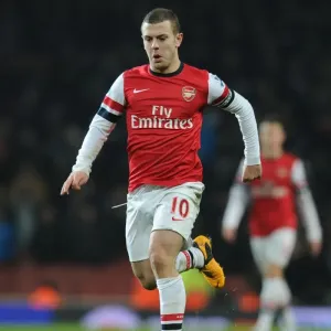 Arsenal's Jack Wilshere Fights for Possession Against West Ham United in the Premier League