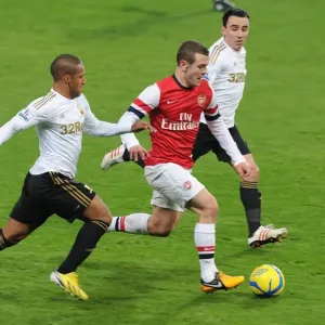Arsenal's Jack Wilshere Goes Head-to-Head with Swansea's Ashley Richards and Leon Britton in FA Cup Clash Arsenal's Jack Wilshere Goes Head-to-Head with Swansea's Ashley Richards and Leon Britton in FA Cup Clash