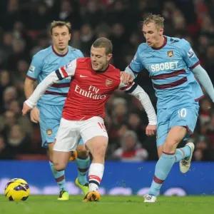 Arsenal's Jack Wilshere Outmaneuvers West Ham's Jack Collison in Premier League Clash