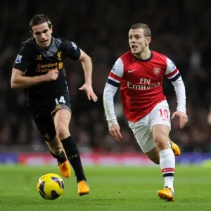 Arsenal's Jack Wilshere Outpaces Liverpool's Jordan Henderson in Intense Premier League Clash