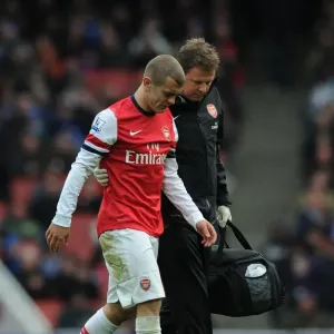 Arsenal's Jack Wilshere Receives Treatment from Physio Colin Lewin vs. Queens Park Rangers (2012-13)