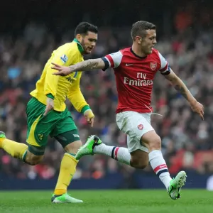 Arsenal's Jack Wilshere Scores Past Norwich's Bradley Johnson - Arsenal vs Norwich City, Premier League 2012-13 Arsenal's Jack Wilshere Scores Past Norwich's Bradley Johnson - Arsenal vs Norwich City, Premier League 2012-13