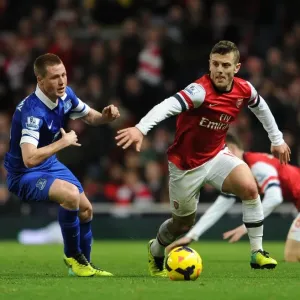 Arsenal's Jack Wilshere vs Everton's James McCarthy: Intense Battle in the Midfield, Premier League 2013-14 Arsenal's Jack Wilshere vs Everton's James McCarthy: Intense Battle in the Midfield, Premier League 2013-14