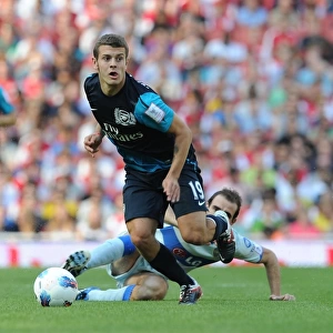 Arsenal's Jack Wilshere vs. Leandro Somoza: A Clash of Midfield Titans at the Emirates Cup, 2011