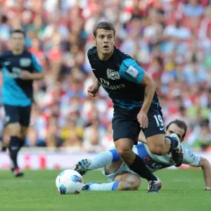 Arsenal's Jack Wilshere vs. Leandro Somoza: A Clash of Midfield Titans at the Emirates Cup, 2011 Arsenal's Jack Wilshere vs. Leandro Somoza: A Clash of Midfield Titans at the Emirates Cup, 2011