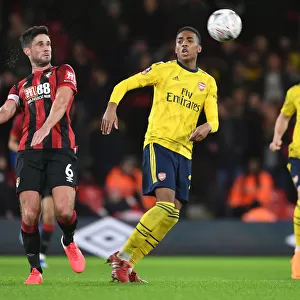 Arsenal's Joe Willock and Andrew Surman Clash in Intense FA Cup Fourth Round Match