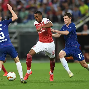 Arsenal's Joe Willock Clashes with Chelsea's Jorginho and Andreas Christensen in the Europa League Final
