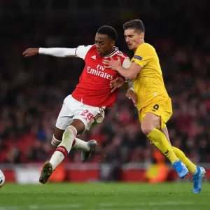 Arsenal's Joe Willock Clashes with Standard Liege's Gojko Cimirot in Europa League Match
