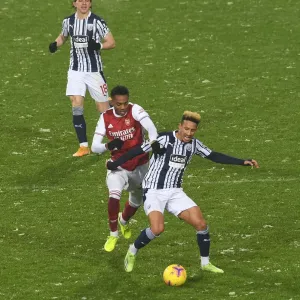 Arsenal's Joe Willock Clashes with West Bromwich Albion's Callum Robinson in Premier League Showdown