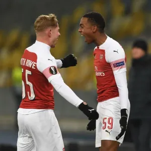Arsenal's Joe Willock and Emile Smith Rowe: Celebrating Goals in Europa League Victory over Vorskla Poltava