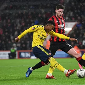 Arsenal's Joe Willock Faces Pressure from Bournemouth's Jack Simpson in FA Cup Clash