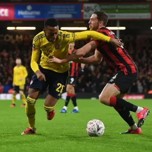 Arsenal's Joe Willock Fends Off Bournemouth's Dan Gosling in FA Cup Clash
