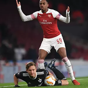 Arsenal's Joe Willock Intimidates Qarabag's Jakub Rzezniczak in Europa League Clash