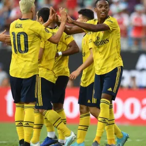 Arsenal's Joe Willock and Mesut Ozil Celebrate Goal Against ACF Fiorentina in 2019 International Champions Cup, Charlotte