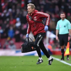 Arsenal's Jordan Reece Attends to Injured Player in Intense Arsenal vs Newcastle United Clash (2021-22)