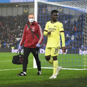 Arsenal's Jordan Reece Tends to Injured Bukayo Saka during Brighton vs Arsenal (2021-22)