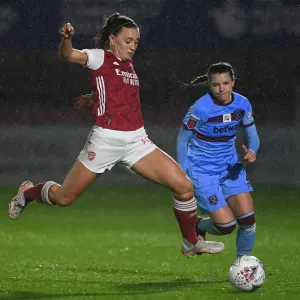 Arsenal's Katie McCabe Battles for Possession in Empty FA WSL Match Against West Ham United Arsenal's Katie McCabe Battles for Possession in Empty FA WSL Match Against West Ham United