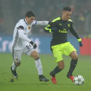 Arsenal's Kieran Gibbs Clashes with Basel's Mohamed Elyounoussi in 2016-17 UEFA Champions League Arsenal's Kieran Gibbs Clashes with Basel's Mohamed Elyounoussi in 2016-17 UEFA Champions League