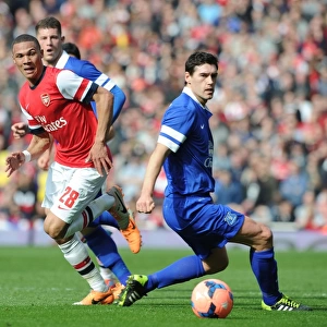 Arsenal's Kieran Gibbs Outmaneuvers Everton's Gareth Barry in FA Cup Quarter-Final Showdown