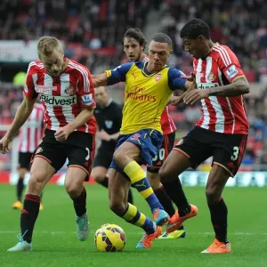 Arsenal's Kieran Gibbs Outmaneuvers Larsson and van Aanholt during Sunderland Clash