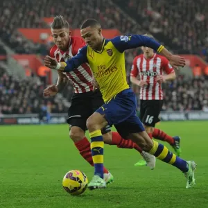 Arsenal's Kieran Gibbs Outmaneuvers Southampton's Toby Alderweireld in Premier League Clash (Southampton v Arsenal 2014-15)