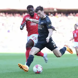 Arsenal's Kieran Tierney Clashes with Nottingham Forest's Serge Aurier in Premier League Showdown
