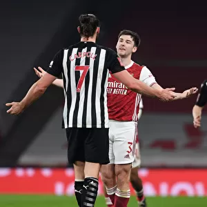 Arsenal's Kieran Tierney Confronts Newcastle's Andy Carroll During FA Cup Clash