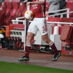 Arsenal's Kieran Tierney in Europa League Action: Arsenal vs. Olympiacos (Behind Closed Doors) Arsenal's Kieran Tierney in Europa League Action: Arsenal vs. Olympiacos (Behind Closed Doors)