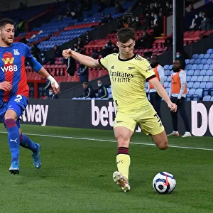 Arsenal's Kieran Tierney Faces Pressure from Crystal Palace's Joel Ward During Premier League Clash