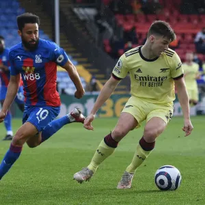Arsenal's Kieran Tierney Fends Off Andros Townsend Challenge in Crystal Palace Clash
