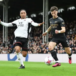 Arsenal's Kieran Tierney Fends Off Fulham's Kenny Tete in Premier League Clash