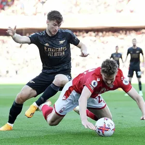 Arsenal's Kieran Tierney Fights for Possession Against Nottingham Forest in Premier League Clash