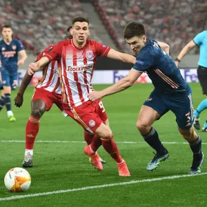 Arsenal's Kieran Tierney Goes Head-to-Head with Olympiacos Lazar Randjelovic in Empty Europa League Stadium