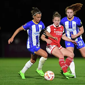 Arsenal's Kim Little Fights Past Defenders in Intense Barclays WSL Showdown Against Brighton