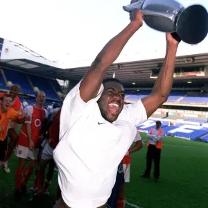 Arsenal's Kolo Toure Celebrates Premier League Victory with Inflatable Trophy at White Hart Lane Arsenal's Kolo Toure Celebrates Premier League Victory with Inflatable Trophy at White Hart Lane