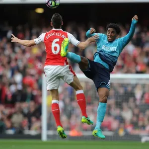 Arsenal's Koscielny Clashes with Swansea's Fer: A Premier League Showdown