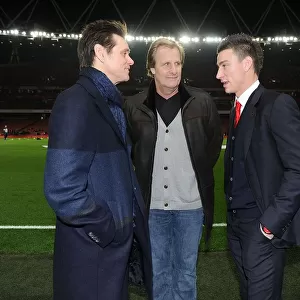 Arsenal's Koscielny Meets Jim Carrey and Jeff Daniels Before Arsenal v Manchester United Match