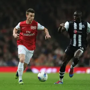 Arsenal's Koscielny Outmaneuvers Newcastle's Ba in Premier League Clash Arsenal's Koscielny Outmaneuvers Newcastle's Ba in Premier League Clash