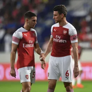 Arsenal's Koscielny and Pleguezuelo in Action against Al-Nasr Dubai SC