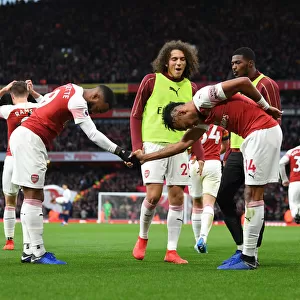 Arsenal's Lacazette and Aubameyang: Unstoppable Duo Celebrates Goals Against Tottenham in the 2018-19 Premier League Clash