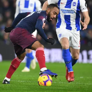 Arsenal's Lacazette Clashes with Brighton's Stephens in Premier League Showdown Arsenal's Lacazette Clashes with Brighton's Stephens in Premier League Showdown