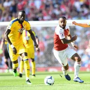 Arsenal's Lacazette Clashes with Kouyate and Milivojevic of Crystal Palace