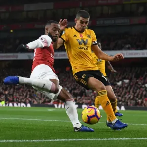 Arsenal's Lacazette Clashes with Wolverhampton's Coady in Premier League Showdown